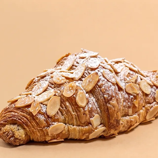Almond croissant dusted with icing sugar