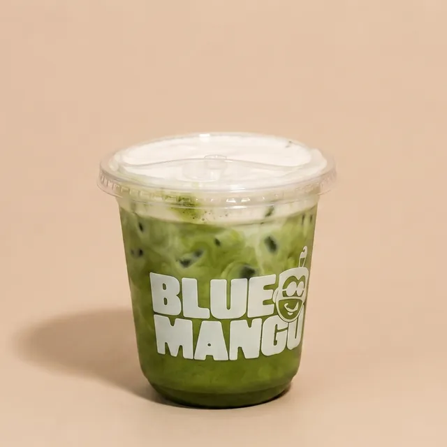 Iced matcha latte in a Blue Mango cup