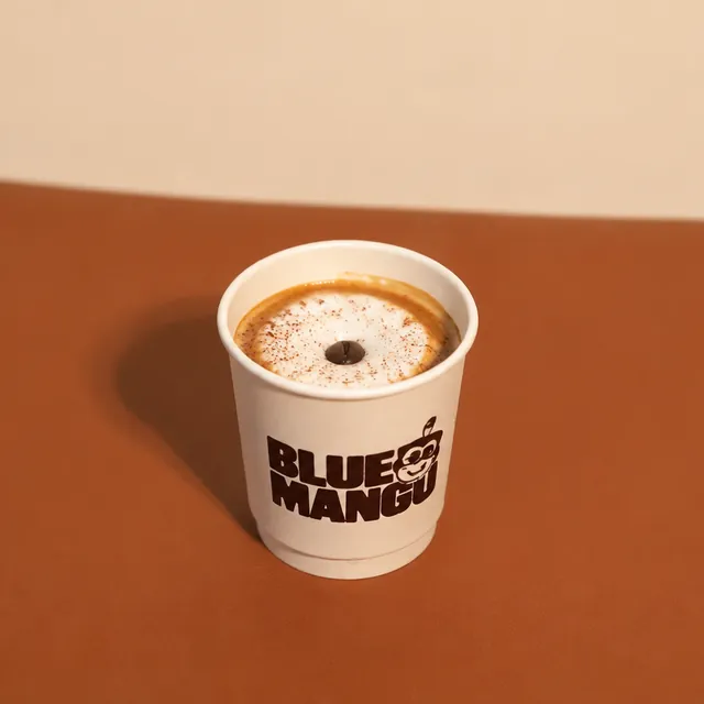 Espresso macchiato in a Blue Mango cup
